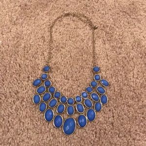 Gold chain necklace with pale blue gems